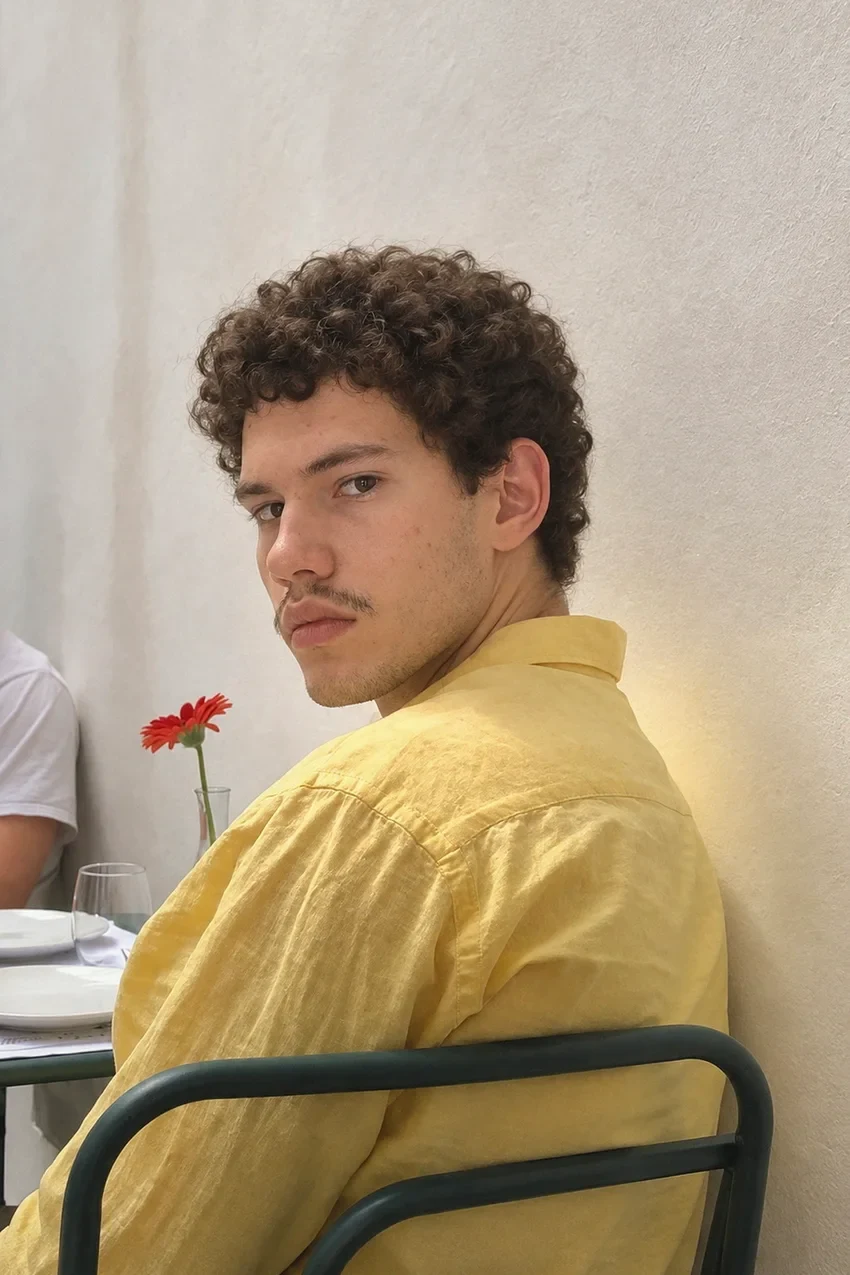 Source Vibein photo of Nan wearing a yellow shirt at a table